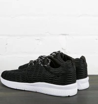 Black sneakers with white sole